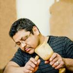 Alex Swiftwater McCarty, a Makah artist who will present a lecture, about the Ozette Village, is pictured working on a carving. (Shauna Bittle)