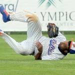 Keith Thorpe/Peninsula Daily News
Lefties' center fielder Golden Tate rolls on the ground after making a diving catch in the top of the third to end Bend's half of the inning on Tuesday in Port Angeles.