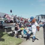 Port Angeles Lefties mascot Timber high-fives young fans at Sundays game at Civic Field. (Pierre LaBossiere/Peninsula Daily News)