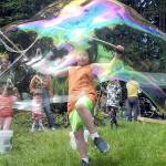 Emmett Stratford, 8, of Port Angeles creates a gigantic soap bubble as one of the childrens activities at Summertide Solstice Festival on Saturday at the Port Angeles Fine Arts Center. (Keith Thorpe/Peninsula Daily News)