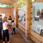 Members of the Polge family from Raleigh, N.C., from left, parents Tami and Steven, and siblings Sebastian, 18, Anna, 15, Christina, 18, and Nico, 7, exmaine an informational display at the Dungeness National Wildlife Refuge north of Sequim on Thursday. (Keith Thorpe/Peninsula Daily News)