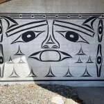 Educator and artist Alex McCarty used a cedar treasure box found at the Ozette site as the inspiration for this mural near the entrance of the museum at the Makah Cultural & Research Center. The museum is a treasure box for the Makah people and then you go inside the museum to try to find the box, McCarty says. (Paula Hunt/Peninsula Daily News)