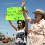 Hilary Soderling of Kirkland, left, and her mother, Lou Ann Soderling of Port Angeles, participate in Saturdays rally at the Clallam County Courthouse. (Keith Thorpe/Peninsula Daily News)