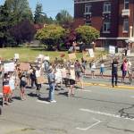 Womens rights supporters block traffic on Lincoln Street in front of the Clallam County Courthouse for one minute symbolizing the report that every minute, a woman dies from complications from child bearing. (Keith Thorpe/Peninsula Daily News)