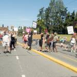 Womens rights supporters block traffic on Lincoln Street in front of the Clallam County Courthouse for 60 seconds on Saturday. (Keith Thorpe/Peninsula Daily News)