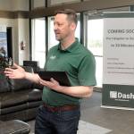 Clint Ostler, president of Dash Air Shuttle, announces details of the startup airlines plans to begin service between Port Angeles and SeaTac Airport in Seattle during a gathering of Port of Port Angeles commissioners and others on Tuesday at William R. Fairchild International Airport. (Keith Thorpe/Peninsula Daily News)