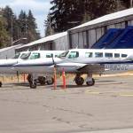 Three Dash Air Shuttle Cessna 403C aircraft sit parked at William R. Fairchild International Airport in August 2021 as they await entering into scheduled service between Port Angeles and SeaTac Airport. (Keith Thorpe/Peninsula Daily News)