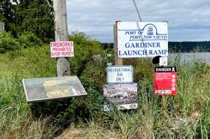 The Port of Port Townsend has installed a no fireworks sign by the entrance to the Gardiner boat launch ramp to discourage illegal fireworks use that has been an ongoing problem, residents say, along with illegal camping and overnight parking in the lot across the road. (Paula Hunt/Peninsula Daily News)