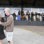 Freia Palmer of Port Angeles and Tom Cox of Port Townsend dance to the music of Olympic Express Big Band during Wednesday nights kickoff show in the Concerts on the Pier music series at Port Angeles City Pier. The free summer music series, hosted by the Juan de Fuca Foundation for the Arts and sponsored by Erika Ralston Word Windemere Real Estate, D.A. Davidson & Co., Elwha River Casino, Washington State Department of Commerce and the Peninsula Daily News, continues at 6 p.m. next Wednesday with the classic rock of Sweet Justice. (Keith Thorpe/Peninsula Daily News)