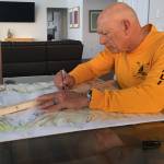 Frank DeSalvo, Sequim Bay Yacht Club commodore and co-chair of the clubs rowing and paddling fundraiser for Volunteer Hospice of Clallam County, outlines the new 8-kilometer course for the Sept. 17 race. (Carolyn DeSalvo)