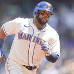 Seattle Mariners' Carlos Santana rounds the bases after he hit a solo home run against the Toronto Blue Jays during the second inning of a baseball game, Sunday, July 10, 2022, in Seattle. (AP Photo/Ted S. Warren)