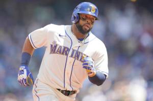 Seattle Mariners' Carlos Santana rounds the bases after he hit a solo home run against the Toronto Blue Jays during the second inning of a baseball game, Sunday, July 10, 2022, in Seattle. (AP Photo/Ted S. Warren)
