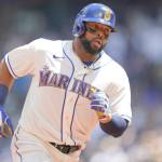 Seattle Mariners' Carlos Santana rounds the bases after he hit a solo home run against the Toronto Blue Jays during the second inning of a baseball game, Sunday, July 10, 2022, in Seattle. (AP Photo/Ted S. Warren)