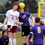 Sequims Aidan Henninger, right, vies for a header with a Kingston defender during a game in April. (Michael Dashiell/Olympic Peninsula News Group)