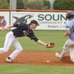 Wilder Sr.'s Wyatt Hall, with ball, tries to tag out a Bellingham Post No. 7 baserunner at second base at Civic Field on Monday. (Dave Logan/for Peninsula Daily News)