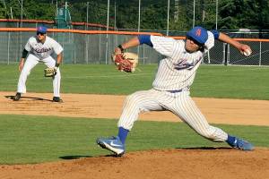 Dillon Dibrell of the PA Lefties fires in a fast pitch to the batter from Kamloops Northpaws. He is backed up by his 3rd baseman B.Y. Choi. dlogan