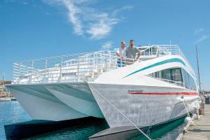 Steve Mullensky/for Peninsula Daily News

Pete Hanke (left) and son Chris, with Puget Sound Express, the 37 year old whale watching tour company based in Port Townsend, stand on the the bow of their new 77 foot tour boat, Swiftsure, while it is being fitted out at Point Hudson Marina on Thursday. The swiftsure will carry up to 145 passengers around the Salish Sea.