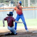 Keith Thorpe/Peninsula Daily News Lefties second baseman Isaiah Munoz, top, tries to cut off a steal by Redmonds Josh Parks on Thursday at Port Angeles Civic Field.