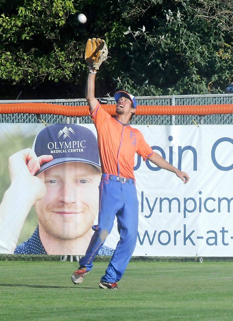 Keith Thorpe/Peninsula Daily News
Leftries centerfielder Colin Curry makes a catch against Redmond on Thursday evening at Port Angeles Civic Field.