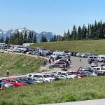 The parking lot at the Hurricane Ridge Visitor Center frequently reaches capacity during the busiest summer days, which creates a line of vehicles at the entrance station at Heart O the Hills waiting to enter Olympic National Park. Clallam Transits Hurricane Ridge that began operating June 1 shuttle can bypass the line and take riders straight to the summit. (Paula Hunt/Peninsula Daily News)