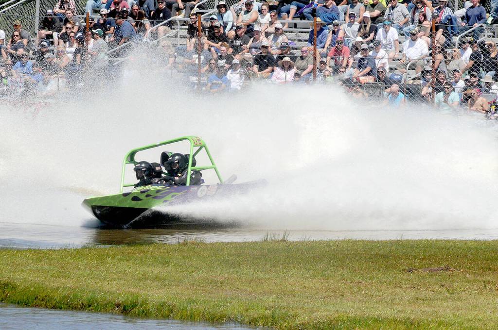 The locally owned Live Wire sprint boat driven by Vaughn Trapp and navigated by Matthew Denson makes it way around the course at Extreme Sports Park in Port Angeles on Saturday. (Keith Thorpe/Peninsula Daily News)