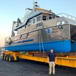 Sanctuary Superintendent Kevin Grant is in the foreground at a 2021 boat launching in Bellingham. (NOAA)