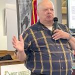 Jim Buck, the 24th Legislative District representative from 1995-2007, lays out what he called the deadly risk that old and seismically unsafe school buildings in Washington pose for children in grades K-12. A state Department of Natural Resources report released last year determined that 93 percent of the schools in a study pose extreme danger for death and entrapment to school children. (Paula Hunt/Peninsula Daily News)