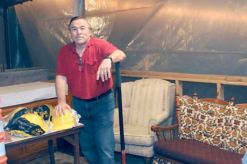 Ron Graham, president of Ghostlight Productions, stands in the former lobby of the Lincoln Theater on Friday in downtown Port Angeles. (Keith Thorpe/Peninsula Daily News)