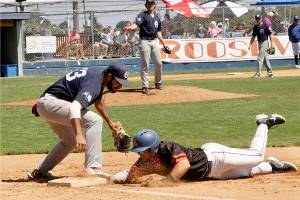 Adam Paganelli of the Port Angeles Lefties gets back to first base safely just before the tag of Victoria HarbourCats first baseman Roberto Gonzalez on a pickoff play. (Dave Logan/for Peninsula Daily News)
