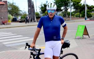 Cyclist Pete Lietz stops in Port Angeles on Monday as he neared the end of his more than 6,000-mile bike ride across the continental U.S. Lietz said the COVID-19 pandemic motivated him to follow through on something hed only thought about, and hes using the opportunity to raise money for mens health. (Peter Segall / Peninsula Daily News)