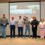 Pictured, in the front row, left to right, are Vicki Lowe, John Christenson, Mayor Tom Ferrell, Robert Whalen, Timmy Wright, Michael Latimer, Kathy Downer, Lowell Rathbun. The back row, on left is Brandon Janisse and, on the right, William Armacost.