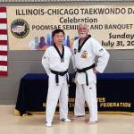 Port Angeles Robert Nicholls with Jo Jah Oh, head technical director from the taekwondo world headquarters in South Korea at the Chicago Taekwondo Day celebration. (Courtesy photo)