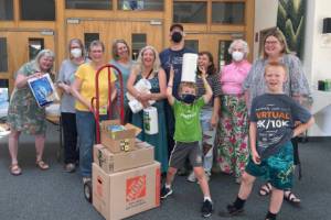 Volunteers compile kits with housewares at Dungeness Valley Lutheran Church for Ukrainian refugees now in Washington. (Photo courtesy of Dungeness Valley Lutheran Church)
