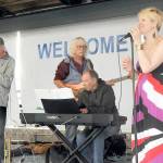 Sarah Shea, right, and members of her band, Chez Jazz, from left, Ed Donohue, Joe DEnrone and Al Harris, perform at Wednesdays Concert on the Pier music series at Port Angeles City Pier. The weekly free music series, presented by the Juan de Fuca Foundation for the Arts and sponsored by Erika Ralston Word/Windermere Real Estate, D.A. Davidson, the Elwha River Casino and the Peninsula Daily News, continues next Wednesday with the Bread and Gravy Quartet. (Keith Thorpe/Peninsula Daily News)