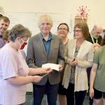 Pictured in the front row, left to right are Ruthie Brandt, Beth Walker, Homer Smith, Cynthia McNulty and Crissy Gelderd. In the middle row, from left to right, Spencer Hay, Andrew Nichol, Kira Kersting (hidden), Mandy Bingham, Stacey Shipley and Violet Snodgrass. George Will, Clallam Mosaic instructor and community engagement coach, is in the back. (Photo by Catherine McKinney)
