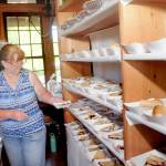 Cheryl Anderson of Joyce stages slices of blackberry pie for sale to the public at the Joyce Daze Wild Blackberry Festival on Saturday in Joyce. (Keith Thorpe/Peninsula Daily News)