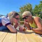 Sarah and Gaye Hickey of Woodinville enjoy some blackberry lemonade during the Fun Ride portion of the Tour de Lavender at In Bloom Lavender Farm on Aug. 6. The mother-daughter riders said theyve wanted to participate in the ride a few years ago but COVID-19 prevented them from participating.
(Matthew Nash/Olympic Peninsula News Group)