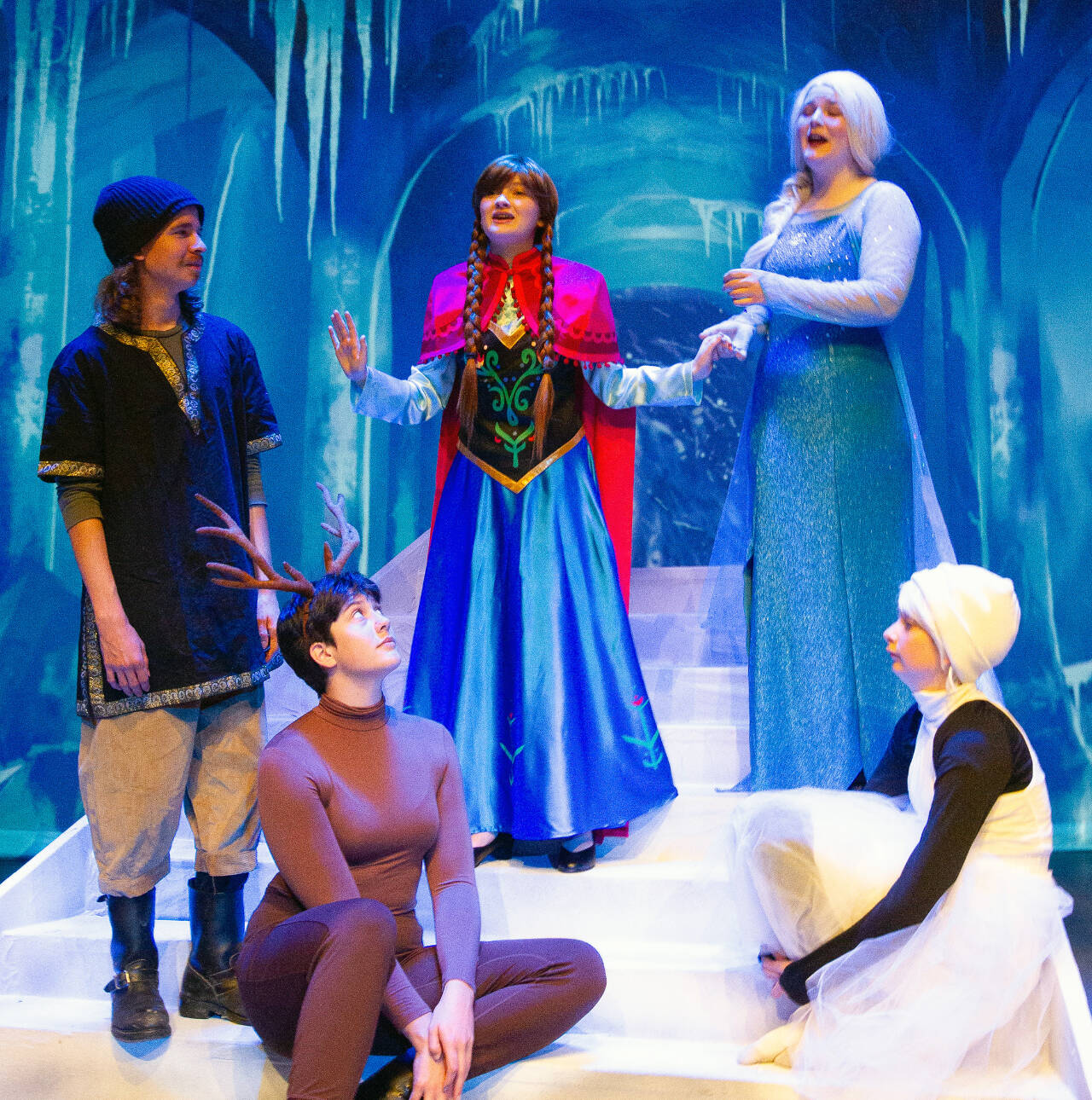 Ghostlight Productions offers Frozen Jr., beginning Friday at the Sequim High School auditorium. Rehearsing a scene last week are, from left, Sean McDaniel as Kristoff, Molly Beeman as Sven, Lili Mitchell as Anna, Olivia Wray as Elsa, and Josie Cooley as Olaf. (Bob Spink/Ghostlight Productions)