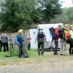 A Jefferson County Search and Rescue team waits at a Jefferson County Sheriffs Office command post as plans are developed to access the site of a plane crash on Wednesday southwest of Gardiner. (Keith Thorpe/Peninsula Daily News)