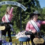 Keith Thorpe/Peninsula Daily News
Fair Queen Allison Pettit, front, and Queen's Court Sophia Lawson, shown on Aug. 6 on their parade float in the Joyce Daze Wild Blackberry Festival, will preside over the Clallam County Fair starting on Thursday in Port Angeles.