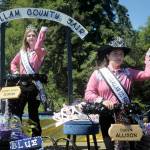 Fair Queen Allison Pettit, front, and Queens Court Sophia Lawson, shown on Aug. 6 on their parade float in the Joyce Daze Wild Blackberry Festival, will preside over the Clallam County Fair starting on Thursday in Port Angeles. (Keith Thorpe/Peninsula Daily News)