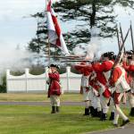 Keith Thorpe/Peninsula Daily News
A group of Revolutionary War re-enactors, playing part of British soldiers, fire their guns during a mock battle during the 2022 NW Colonial Festival at the George Washington Inn and Estate near Agnew. The eighth-annual event featured historical demonstrations, childrens activities, educational discussions about life in the 1700s and skirmishes between British Regulars and a colonial militia.