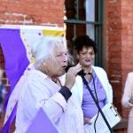 Julie Jaman, the 80-year-old woman at the center of a controversy around transgender access to bathrooms, speaks at a protest across from Port Townsend City Hall on Monday. Jaman was banned from the local pool after she confronted a transgender woman in the locker room, and the event has gained national attention. Jaman and her supporters were surrounded by protestors Monday evening who shouted and made noise while they tried to speak, and scuffles broke out between the two groups. (Peter Segall / Peninsula Daily News)