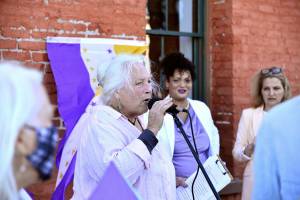 Julie Jaman, the 80-year-old woman at the center of a controversy around transgender access to bathrooms, speaks at a protest across from Port Townsend City Hall on Monday. Jaman was banned from the local pool after she confronted a transgender woman in the locker room, and the event has gained national attention. Jaman and her supporters were surrounded by protestors Monday evening who shouted and made noise while they tried to speak, and scuffles broke out between the two groups. (Peter Segall / Peninsula Daily News)