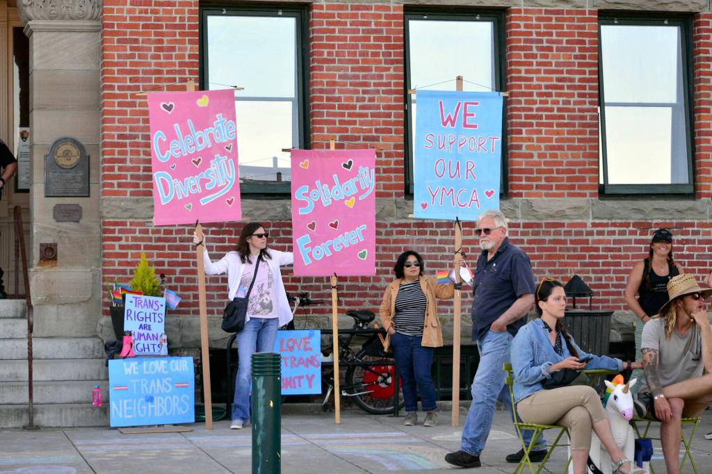 Supporters of transgender rights gathered in front of Port Townsend City Hall on Monday during a city council meeting when a proclamation was read stating the city is a welcoming place for transgender people. An 80-year-old womans ban from the local swimming pool following a confrontation with a transgender woman in the locker has received national attention, and people on both sides of transgender issues traveled to Port Townsend to show their support for their respective sides. (Peter Segall / Peninsula Daily News)