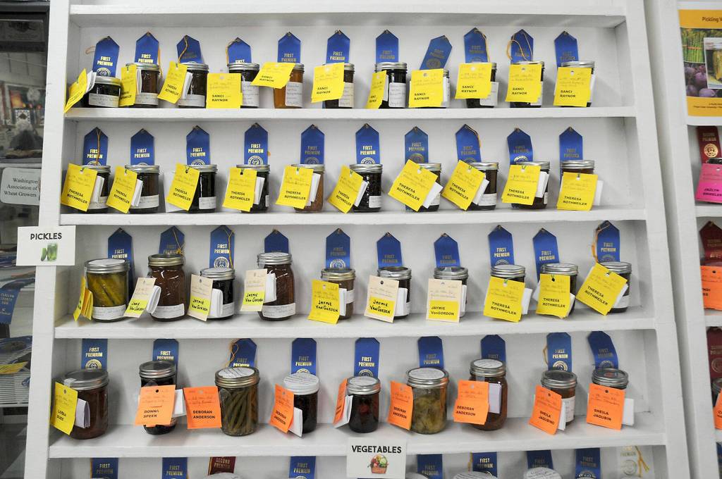 Jars of pickles stand on display with their ribbons on Thursday at the Clallam County Fair. (Keith Thorpe/Peninsula Daily News)