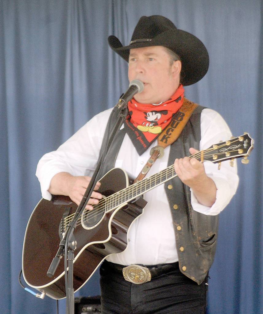 Sequim musician Buck Ellard performs on the Sunny Farms Stage on Saturday at the Clallam County Fair. (Keith Thorpe/Peninsula Daily News)