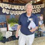 Ron Crawford, one of seven Washington State Fair commissioners, visited the Clallam County Fair on Saturday to evaluate it in a wide range of categories from the quality of its livestock and agricultural exhibits to cleanliness to the education value of displays. (Paula Hunt/Peninsula Daily News)