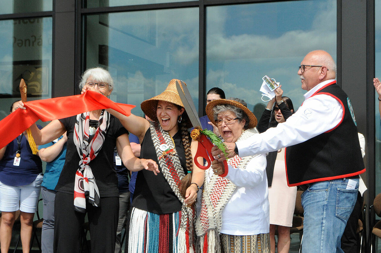 To usher in the Jamestown SKlallam Tribes Healing Clinic, from left, Dana Ward, tribal council member; Loni Greninger, council vice chair; Elaine Grinnell, elder, and W. Ron Allen, chairman, cut the ribbon on the facility that aims to help people overcome opioid use disorder. (Matthew Nash/Olympic Peninsula News Group)