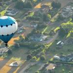A hot air balloon piloted by Captain Crystal Stout drifts over the Dungeness Valley west of Sequim in this 2012 file photo. (Keith Thorpe/Peninsula Daily News)